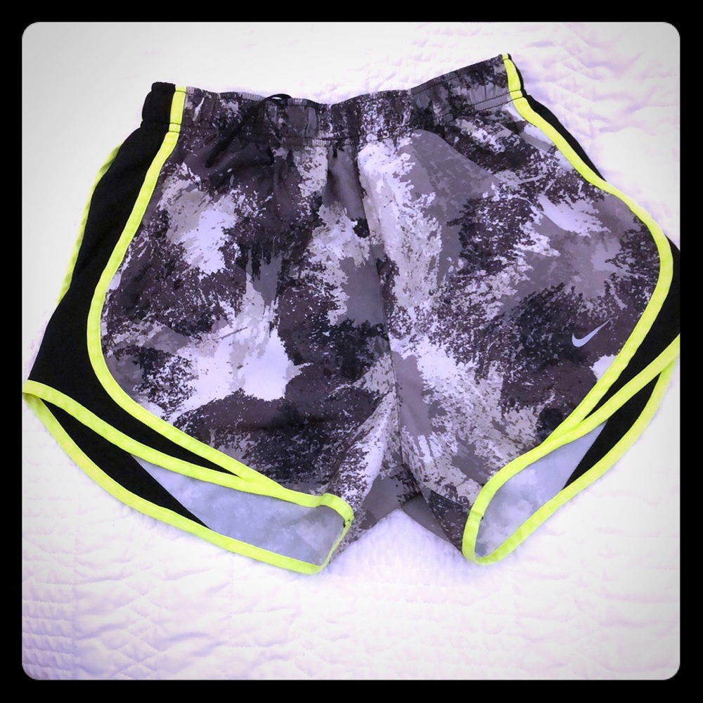 Neon green/yellow and shades of grey Nike shorts.
